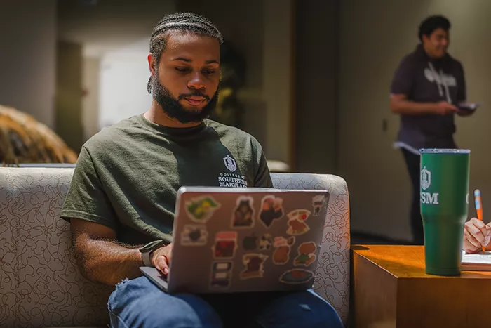 Student works on his computer