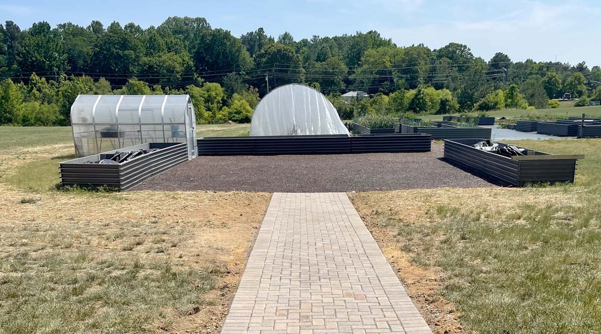 Walkway made of pavers leading to the vegetable garden