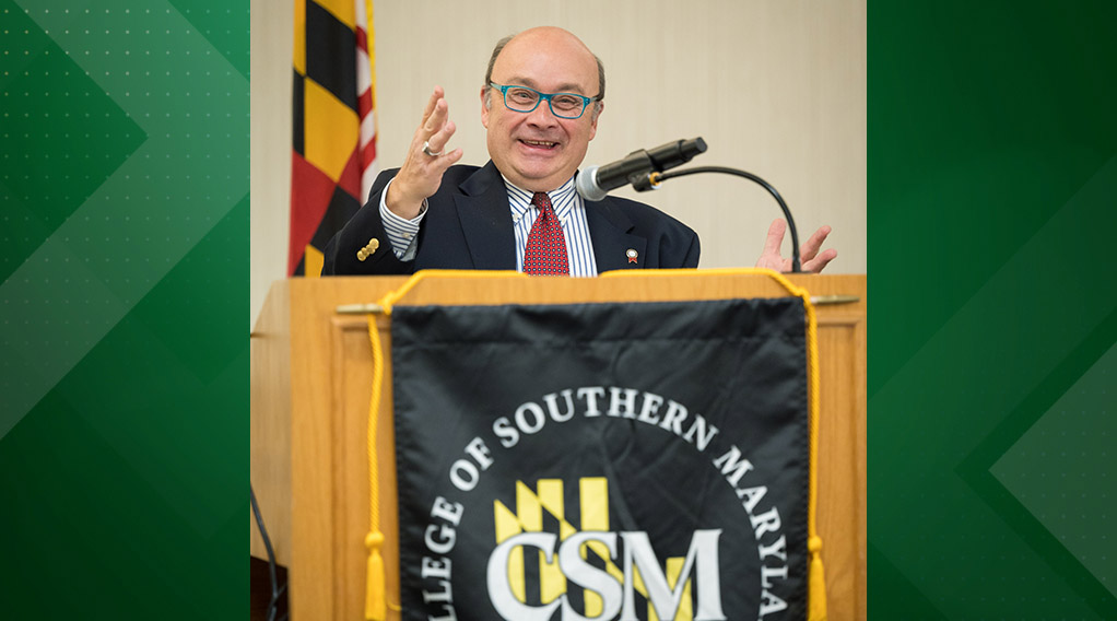Professor of Business Christopher Ripley speaking at podium